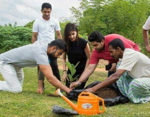 planting a sapling at the Aliya Resort and Spa in Sri Lanka 2